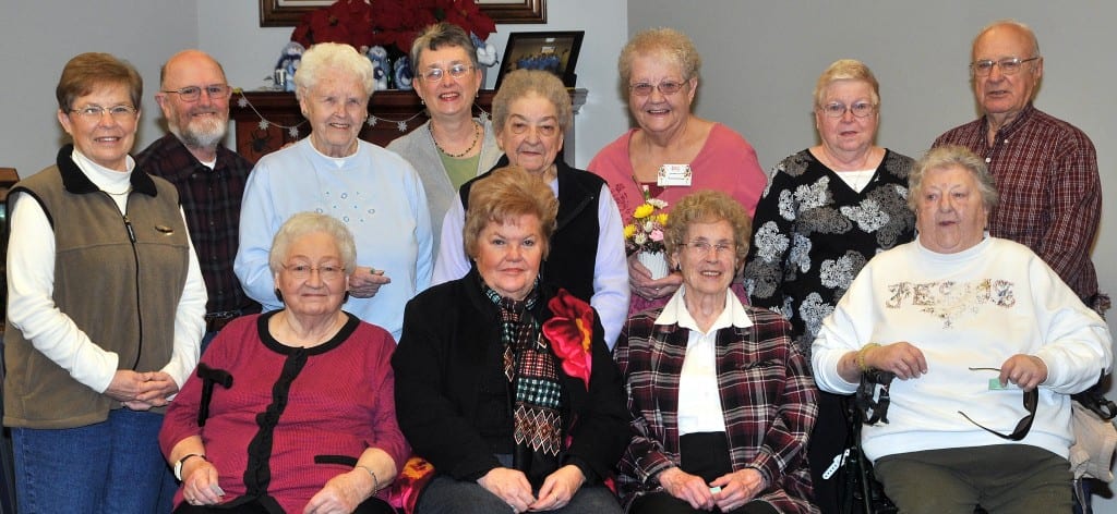 SPECIAL DAY … Celebrating January Birthdays at Montpelier Senior Center on Friday, January 11, 2013 were, seated from left, Margaret Gordon, Beverly Laughlin, Marge Michael, Mary Ellen Pressler and standing from left, Elnor Geren, Jim Martin, Vi Pressler, Sharon White, Beatrice Bechtol, Joanne Stemen, Donna Stahler and Richard Apt.  Assisting as servers for this month’s Birthday celebration, hosted by Evergreen Manor Nursing Home, were T.R.U.S.T. students from Bryan High School.  Site Manager Jewel Head was also pleased to announce Joanne Stemen (floral arrangement from Huntington Bank tellers) and Margaret Gordon (two free Senior Center Lunches) as January’s Monthly Door Prize winners.