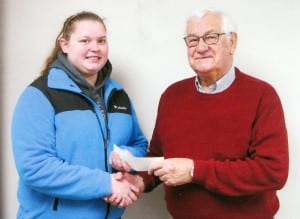AWARDED ... Rebecca Rush receiving the scholarship from Lowell Beaverson. 