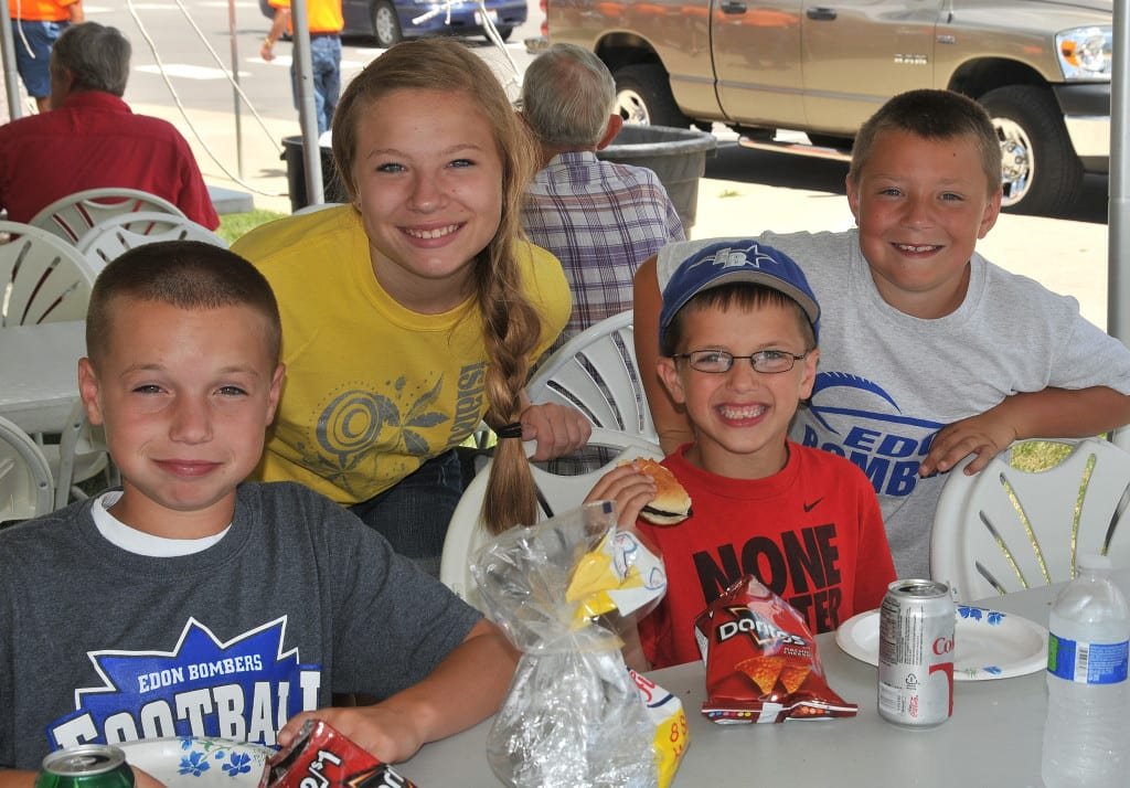 SUMMER FUN … Kelby Sapp, Samantha Trausch, Kyler Sapp and Jarrett Trausch, from left, joined other Edon area residents for a few hours of fun, food and fellowship at The Edon State Bank Company’s 16th Annual Customer Appreciation Day.  