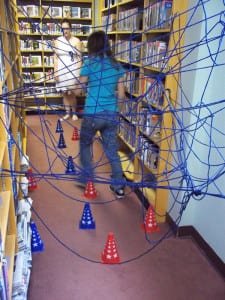 A STICKY SITUATION ... Cheyanne Keller makes her way through the obstacle course during the Spider Relay Race
