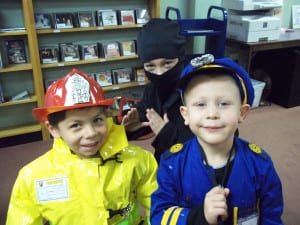 SUPERHEROES! ... This trio of young men were excited to get their picture taken. Fireman Alexander Flores, Ninja Colton Morgan, and Policeman Isaiah Weed smile for the camera.