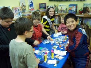CRAFTY BUNCH ... The children also made crafts during the party. From left to right are: Zach Secord, Evan Livengood, Makana Swindell, Emily Eustace, Paige Oxender, Sophie Eustace (partially hidden), and Mario Marmolejo.