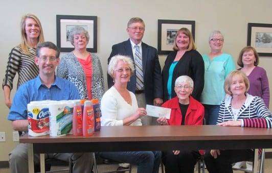 Bryan Area Foundation representatives presented a check to We Care Cabinet and the United Way of Williams County to help the organization purchase shelving and tables for the warehouse. On hand for the event were, back row from left, Chastity Yoder of the United Way of Williams County; Kay Byroads of Community Compassion; Bob Berning of We Care Cabinet; Cheryl Sanders of Open Hands, Caring Hearts; Sandy Dukes, Eastland Baptist Pantry and Beverly Barnett, Edgerton Food Pantry; front row from left, David Miller Edon Area Ministerial Association Food Pantry; Vicki Long, We Care Cabinet (UWWC); Betty Frank, Bryan Area Foundation and Connie Tipton, Bryan Area Foundation.