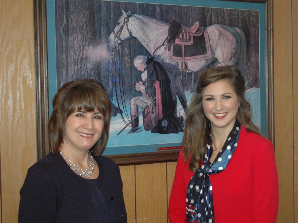 Carol Kurivial, who along with daughter Kristen, founded Luminous Ministries, was the keynote speaker at the 42nd Annual Bryan Area Prayer Breakfast. She talked about the importance of Christians being devoted to prayer for the sake of the nation. Kristen Kurivial, who also spoke, stands with Carol in front of a painting of George Washington kneeling in prayer outside of Valley Forge, Pa. Carol referenced paintings like it in her talk, unaware the church had a copy hanging in its foyer.