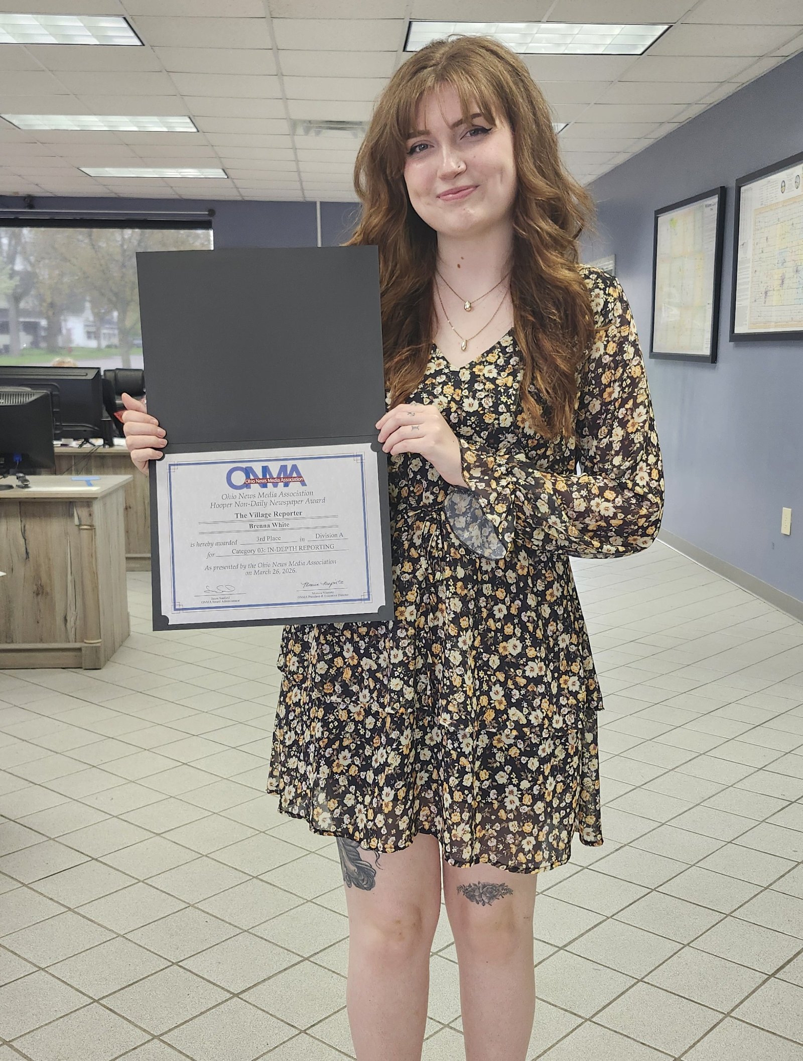 Brenna White holds her ONMA certificate