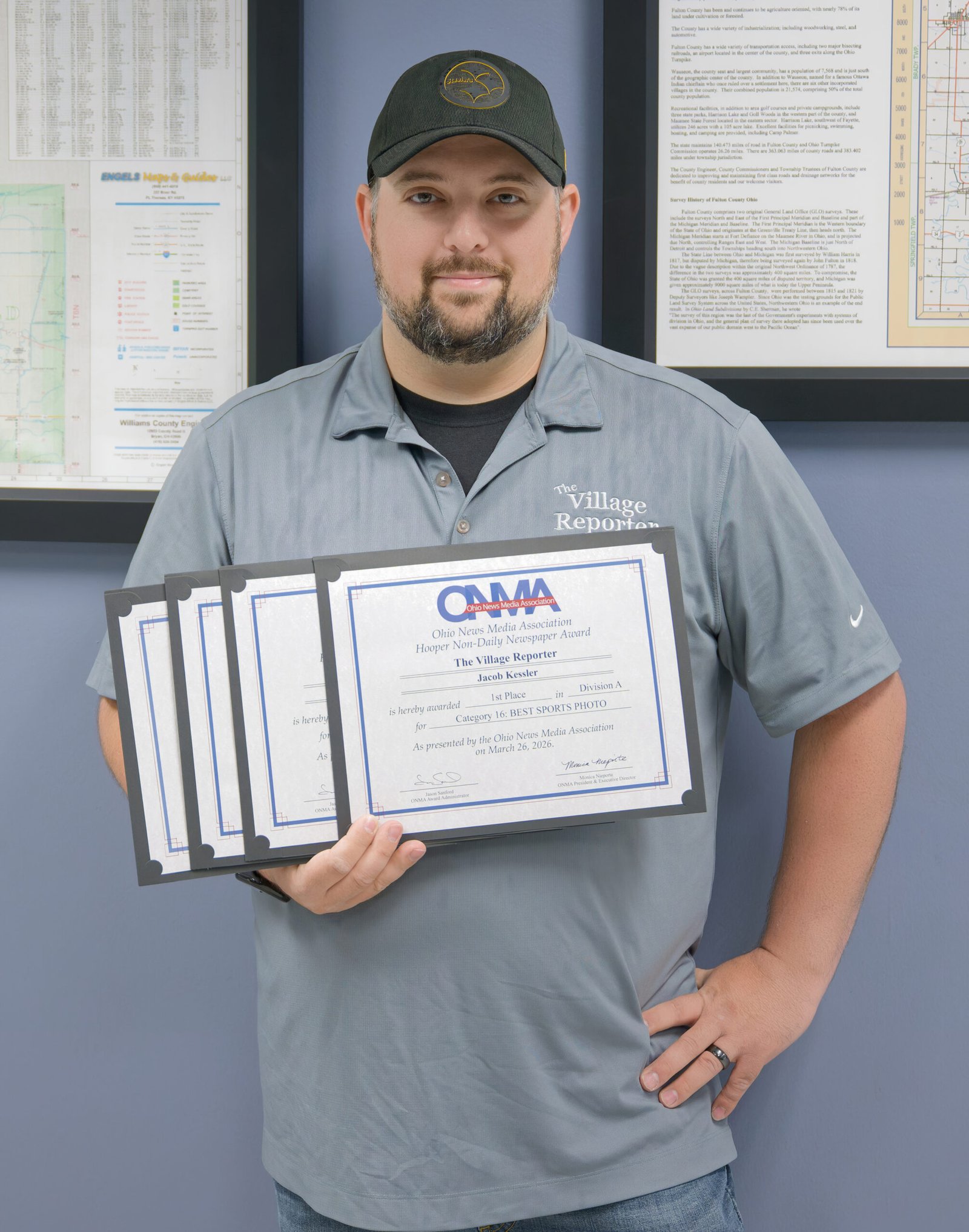 Jacob Kessler holds the stack of ONMA certificates