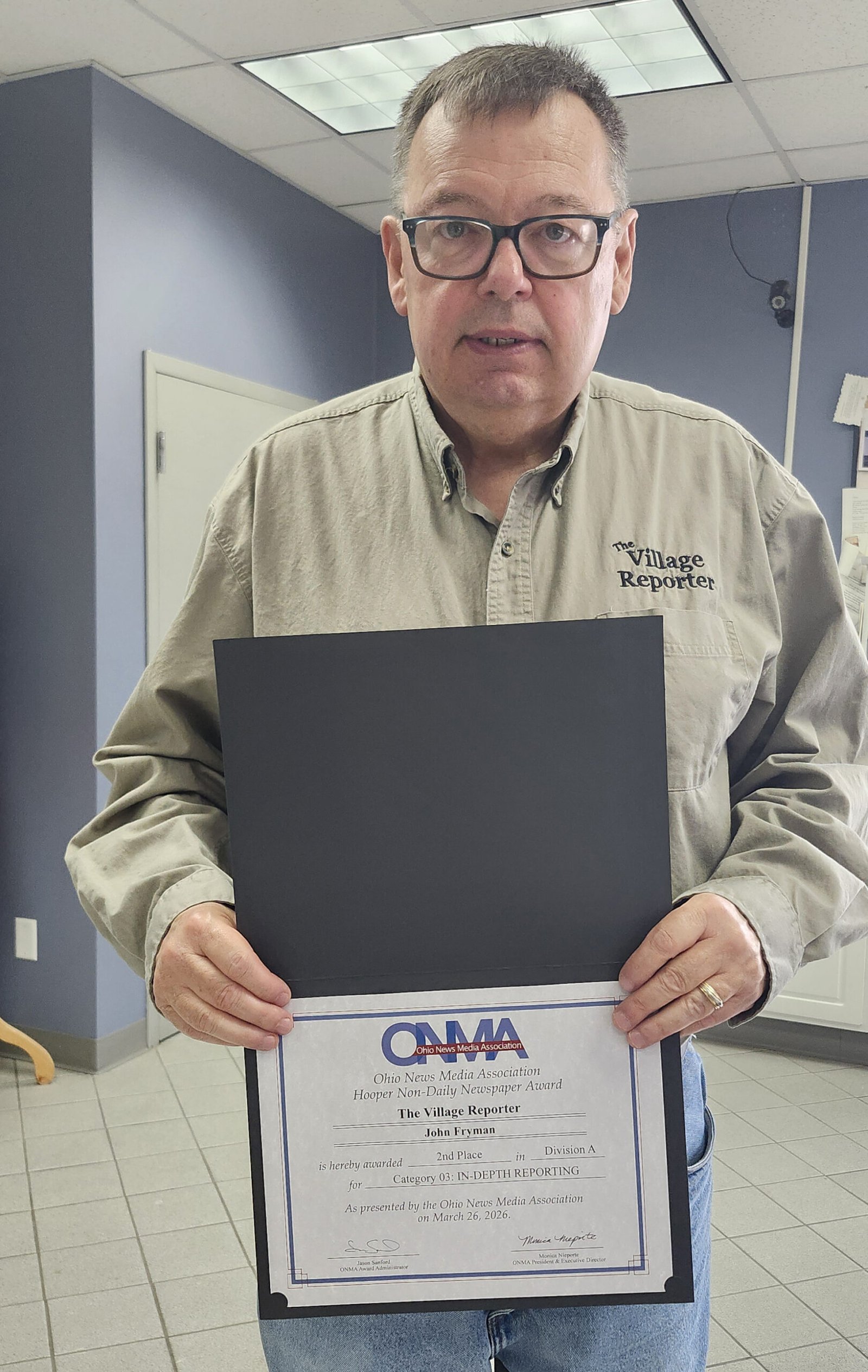 John Fryman holds his ONMA certificate