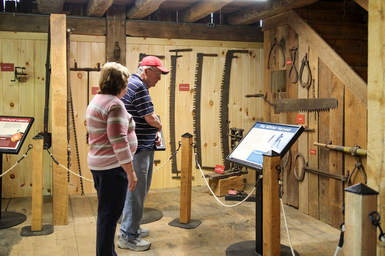 Inside the historic barn at Barkcamp State Park with interpretive panels