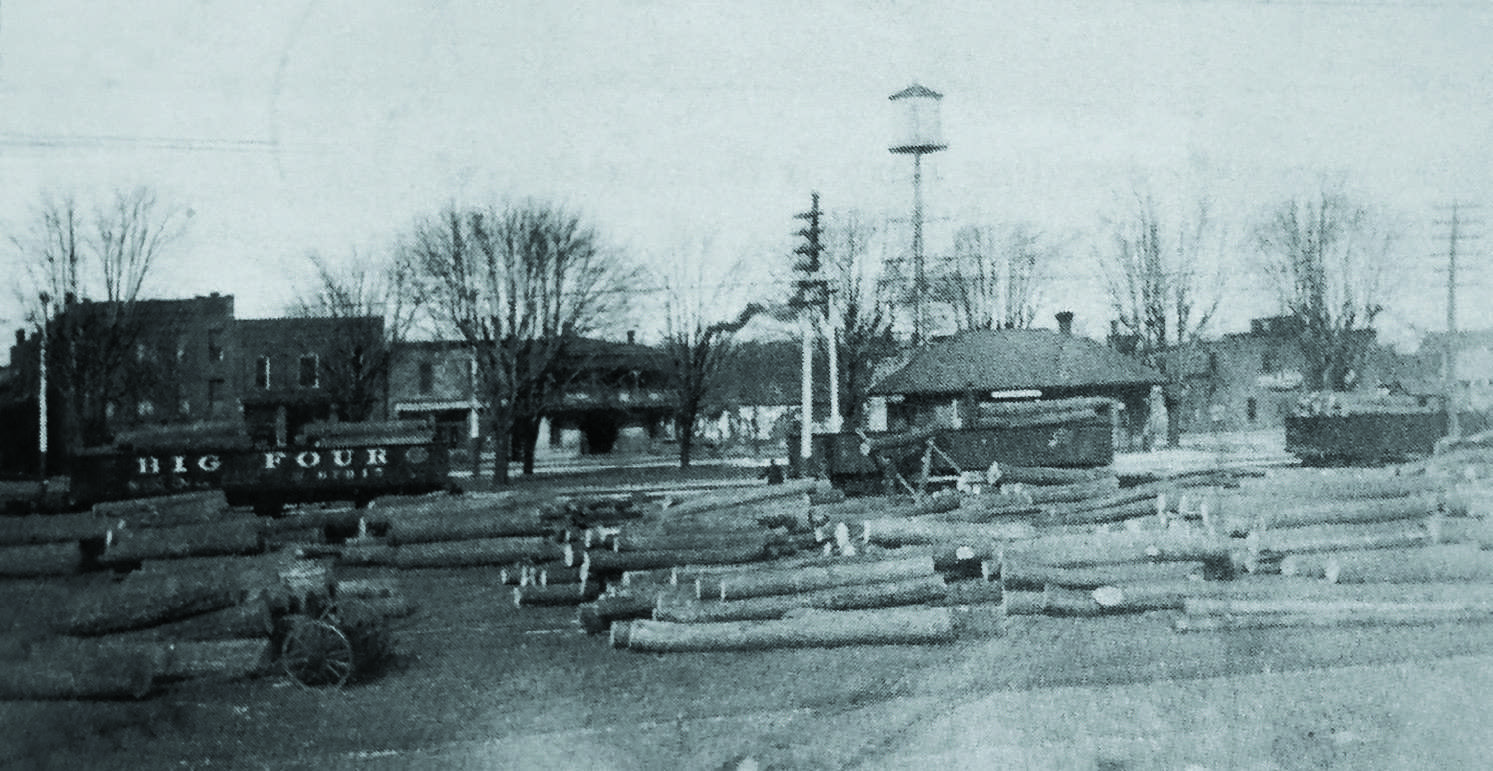 Loading logs onto railcars in Swanton, circa 1915 — Fulton County Historical Society