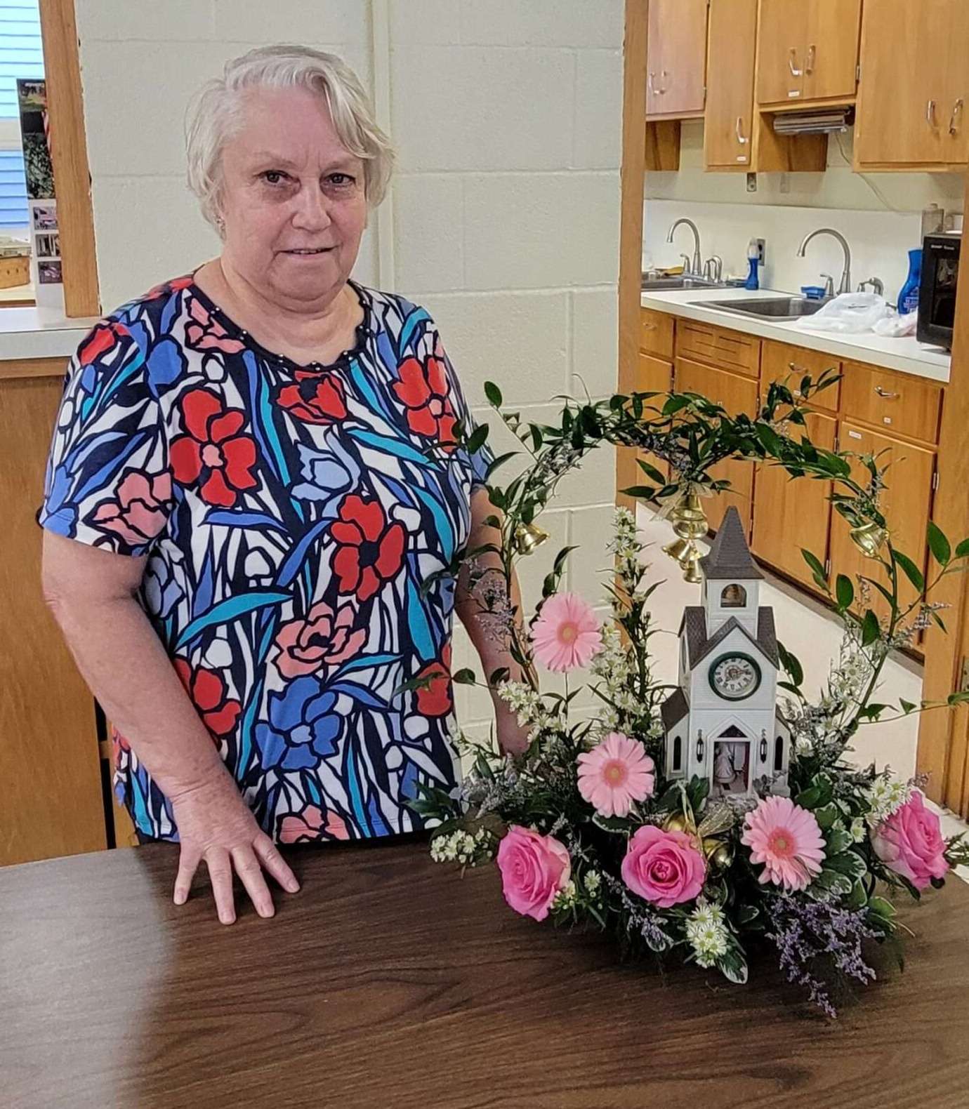 Sandy Oberlin with her Wedding Bells floral arrangement