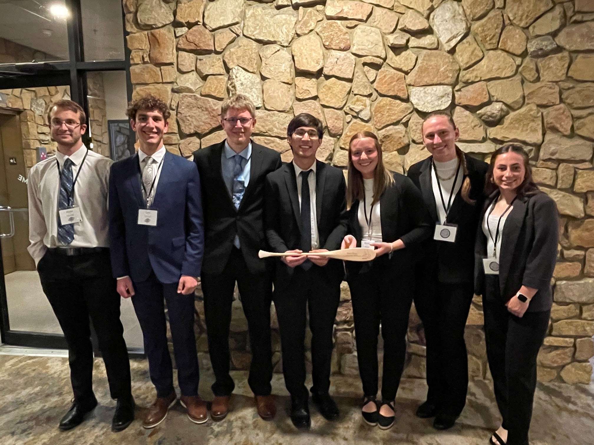 Trine University civil engineering students, from left, Blake Dulle of Edon, Ohio, Levi Webb of Auburn, Indiana, Trenton Wiemken of Defiance, Ohio, Dillan Cooper of Seymour, Indiana, Emma-Lyn Stephenson of Cadott, Wisconsin, Shyanne Gibboney of Greenville, Ohio, and Brook Shelburne of Angola, Indiana, placed third in the ASCE concrete canoe competition.