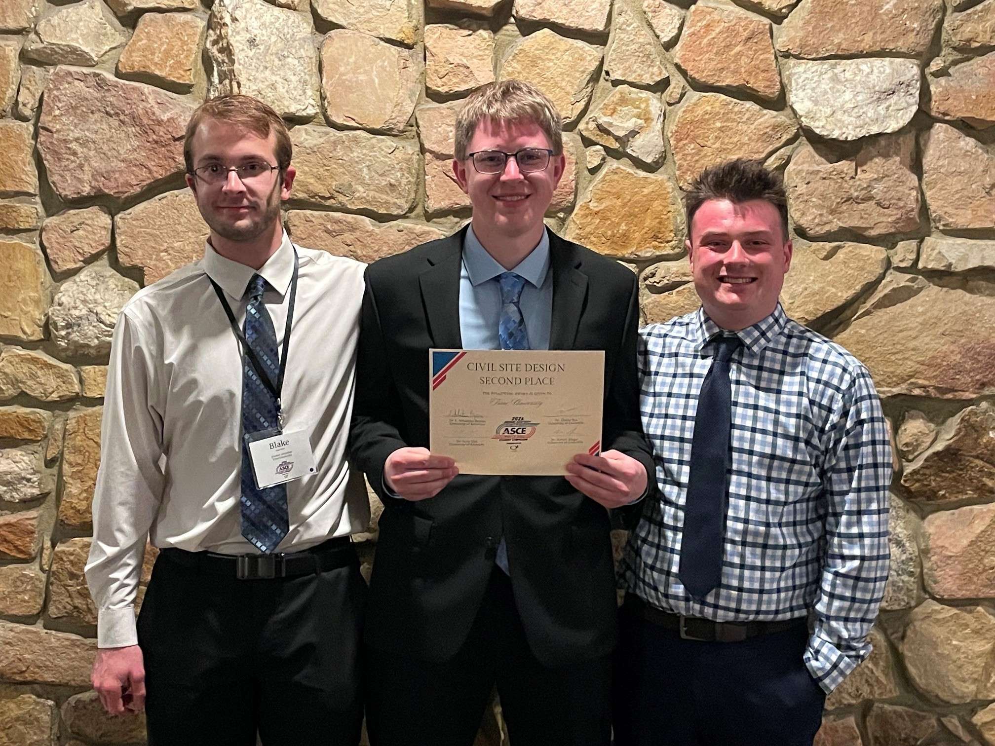 Trine University civil engineering students, from left, Blake Dulle of Edon, Ohio, Trenton Wiemken of Defiance, Ohio, and Brody Fox of Rushville, Indiana, placed second in the ASCE site development competition.