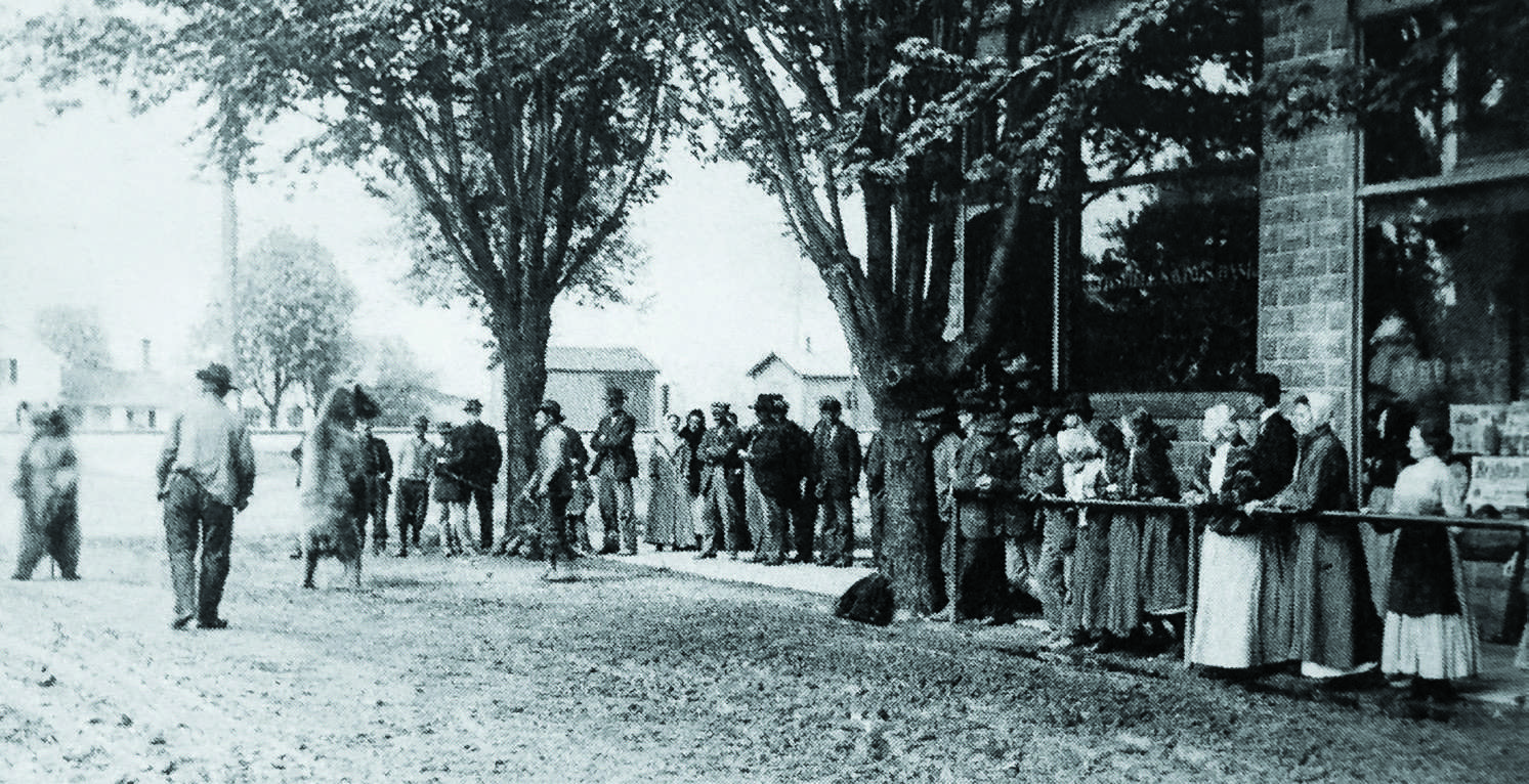Dancing bears perform on Main Street in Pettisville, circa 1905