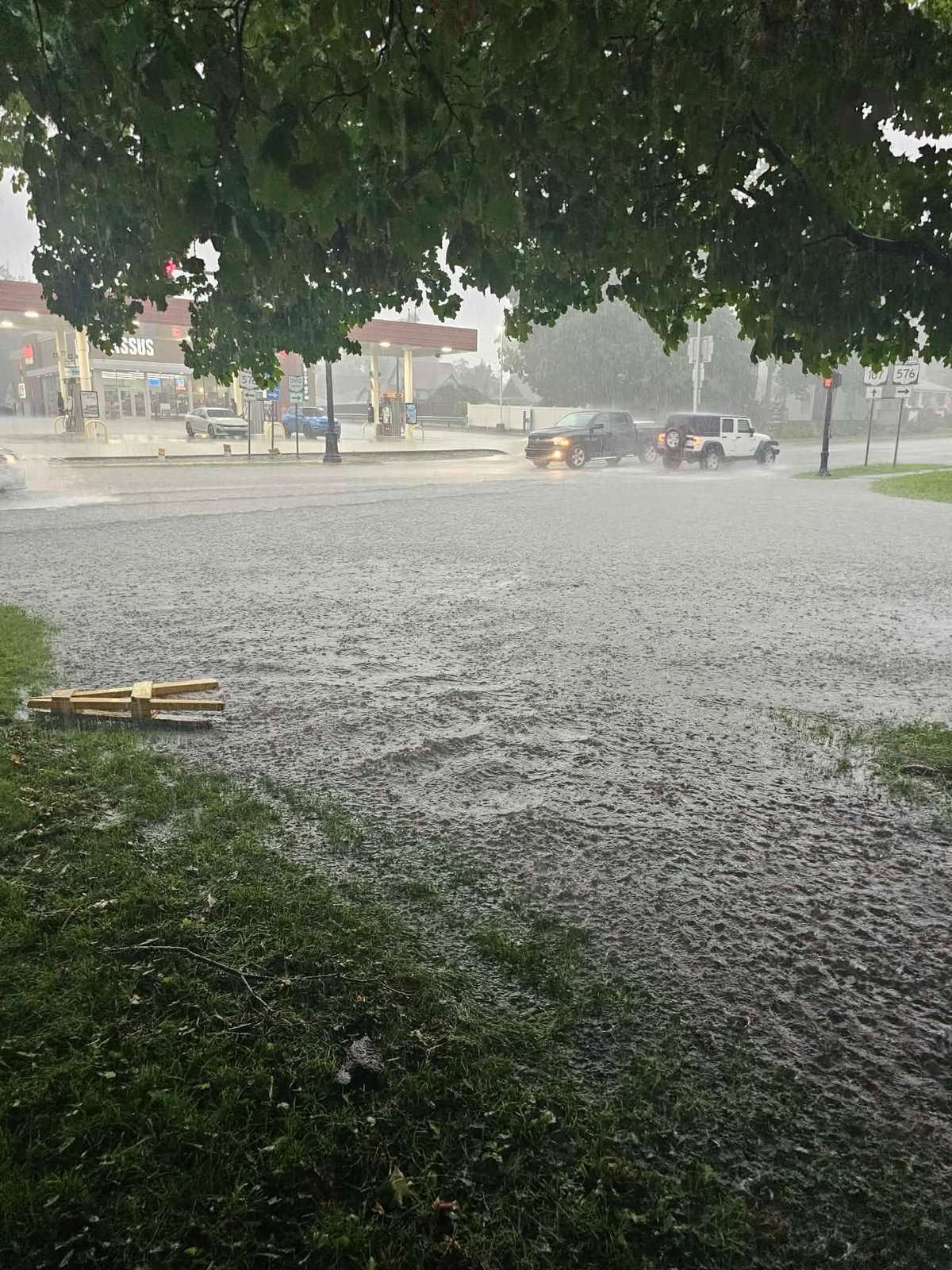 Heavy rain falls over a flooded Montpelier-area street, July 17, 2026.