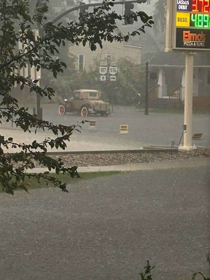 Heavy rain falls near a Montpelier-area gas station, July 17, 2026.