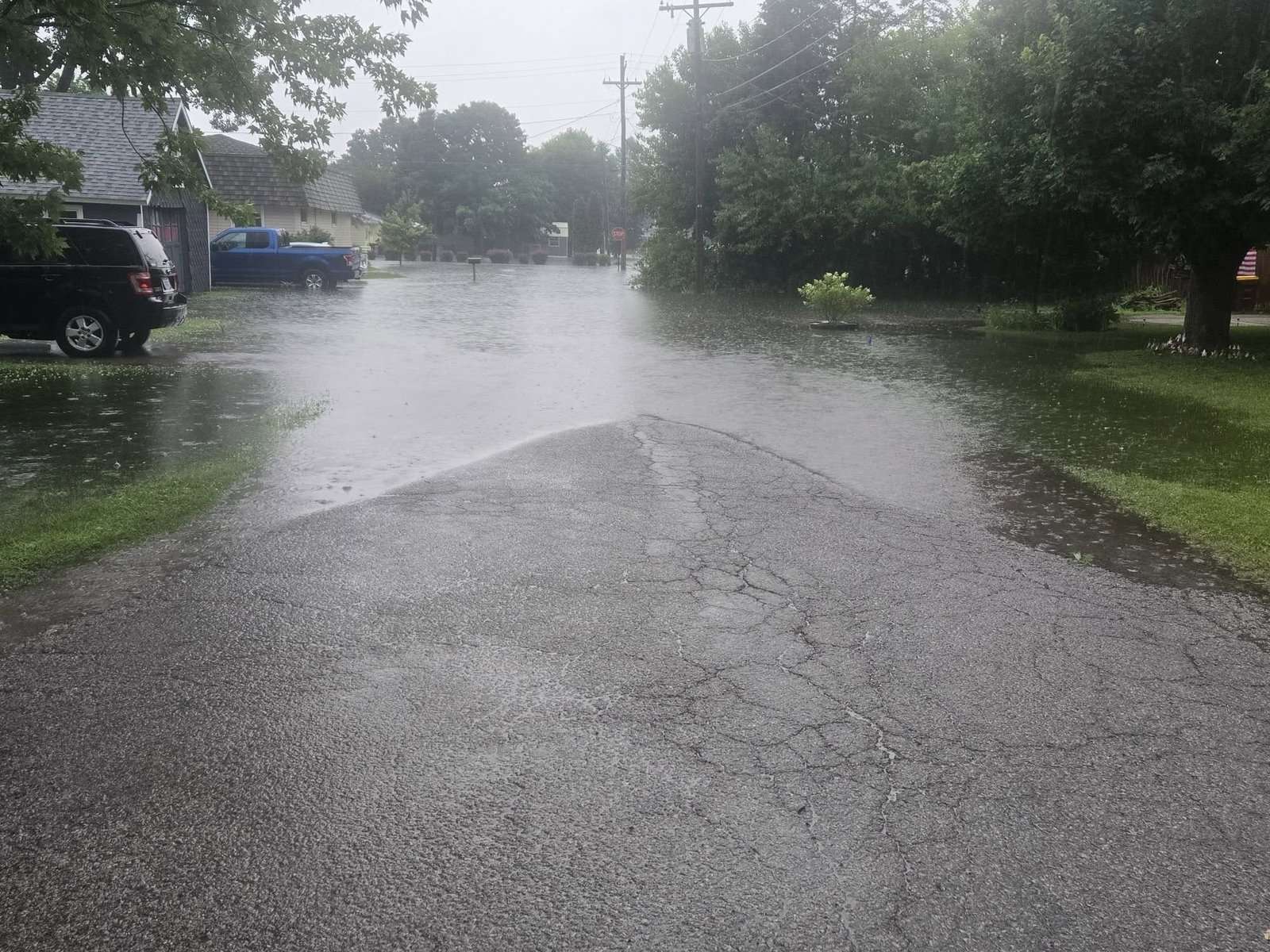 Standing water lines a residential street in the Montpelier area, July 17, 2026.