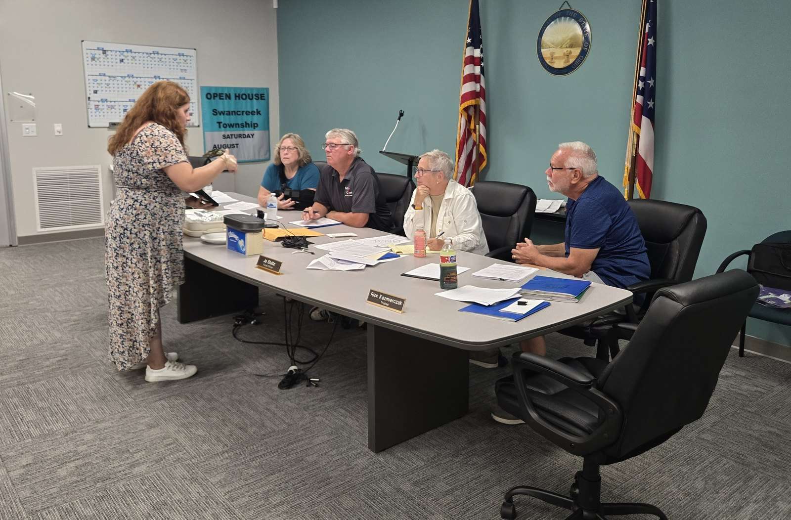 Swancreek Township employee Tiffany Ford demonstrates a new Apple tablet-based system for the trustees at a recent meeting.