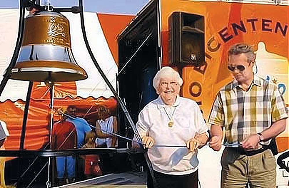 Charlene Sostoi and her son Martin Sostoi ring the Williams County Ohio Bicentennial Bell for the first time at the 2003 Williams County Fair