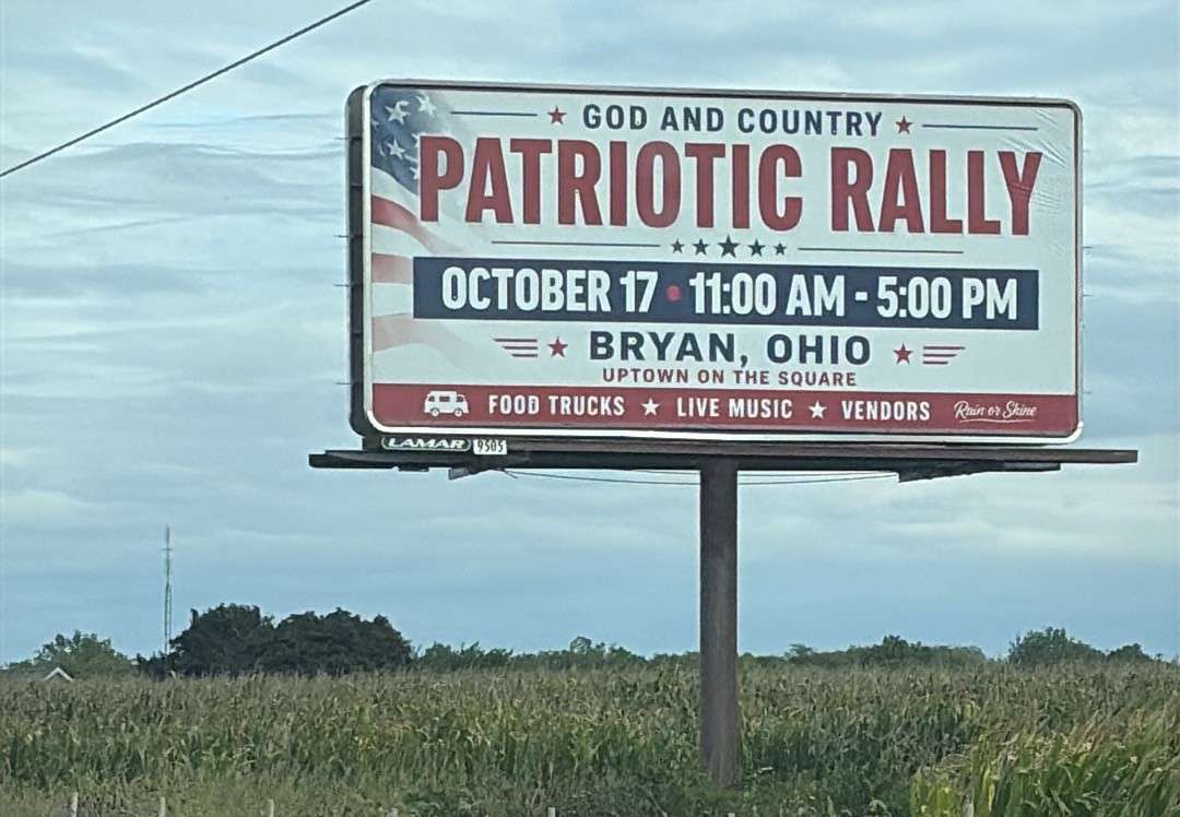 Roadside billboard advertising the God and Country Patriotic Rally in Bryan