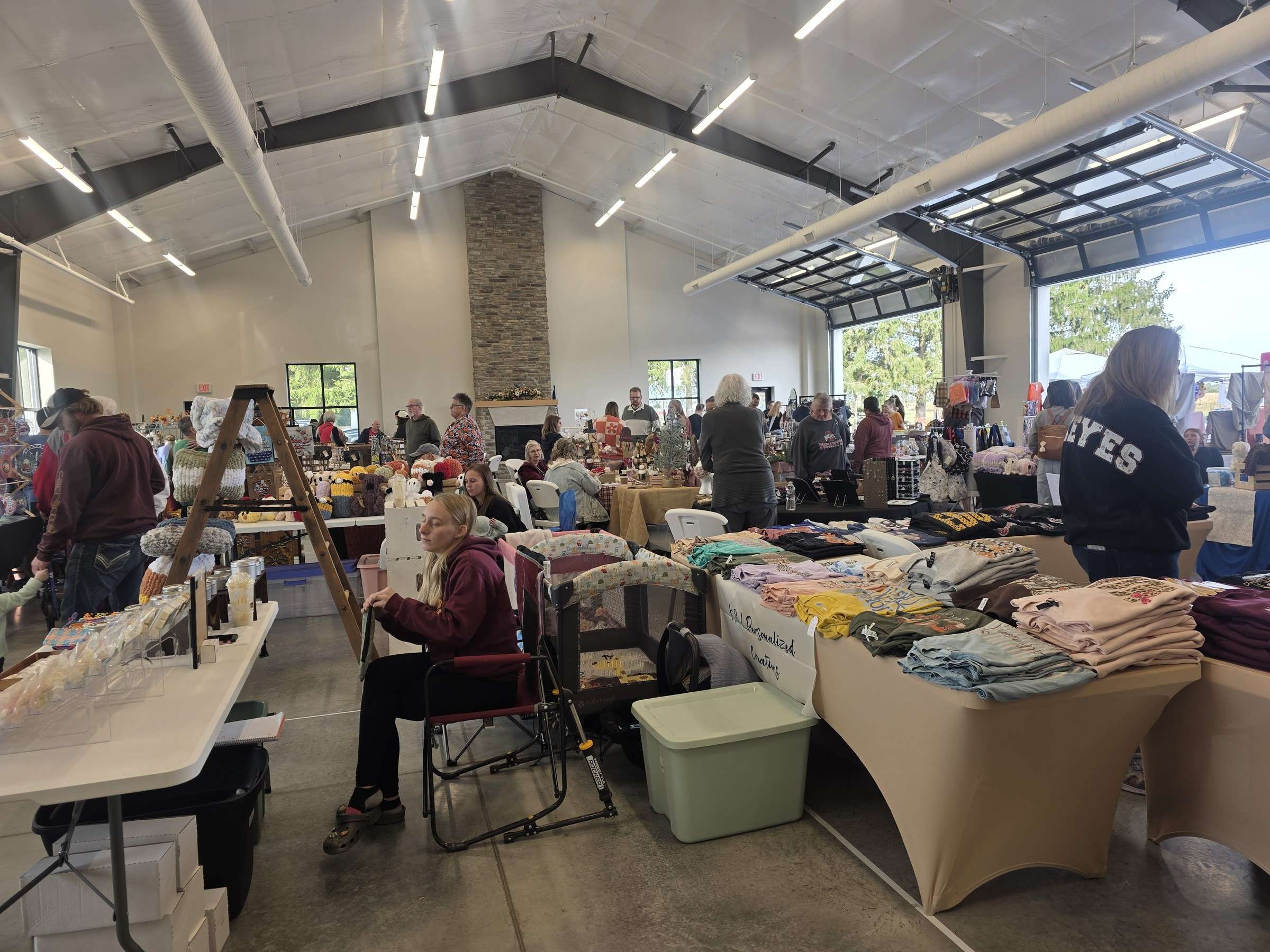 Vendor tables fill the hall at the Hometown Holiday Market in Edgerton