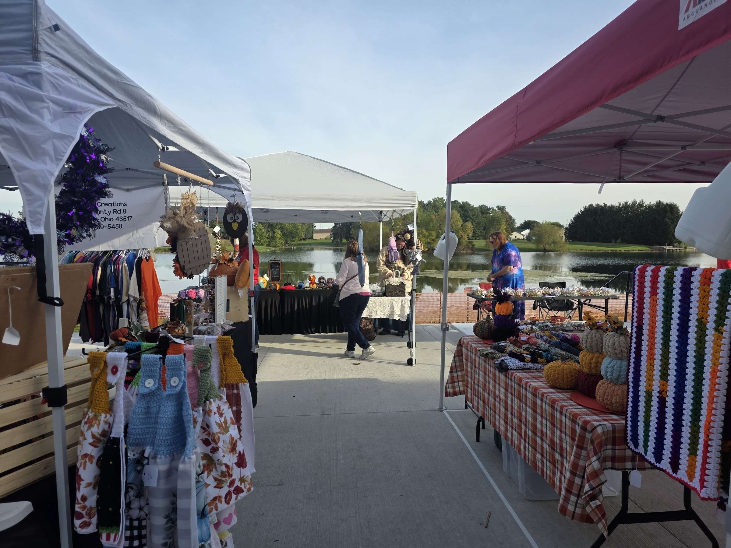 Clothing vendors under tents outside the community center