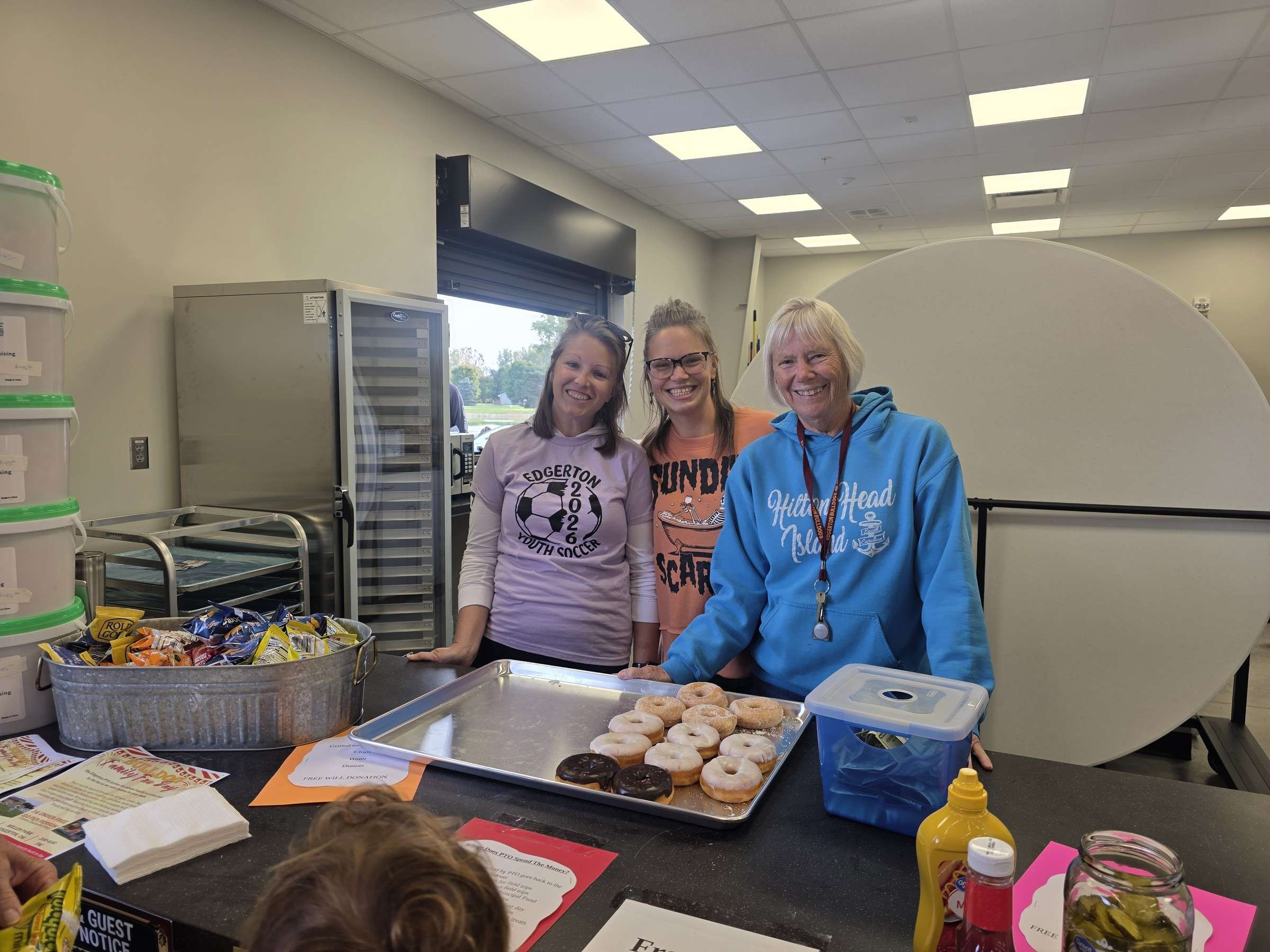 Three PTO members at the food table