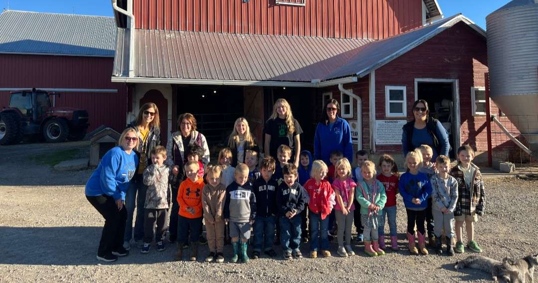Stryker Preschool morning class and teachers in front of a red barn