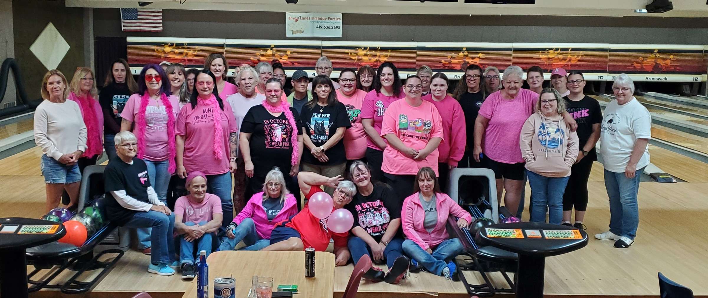 Women bowlers of the Thursday Night Twilight League wearing pink at Bryan Lanes