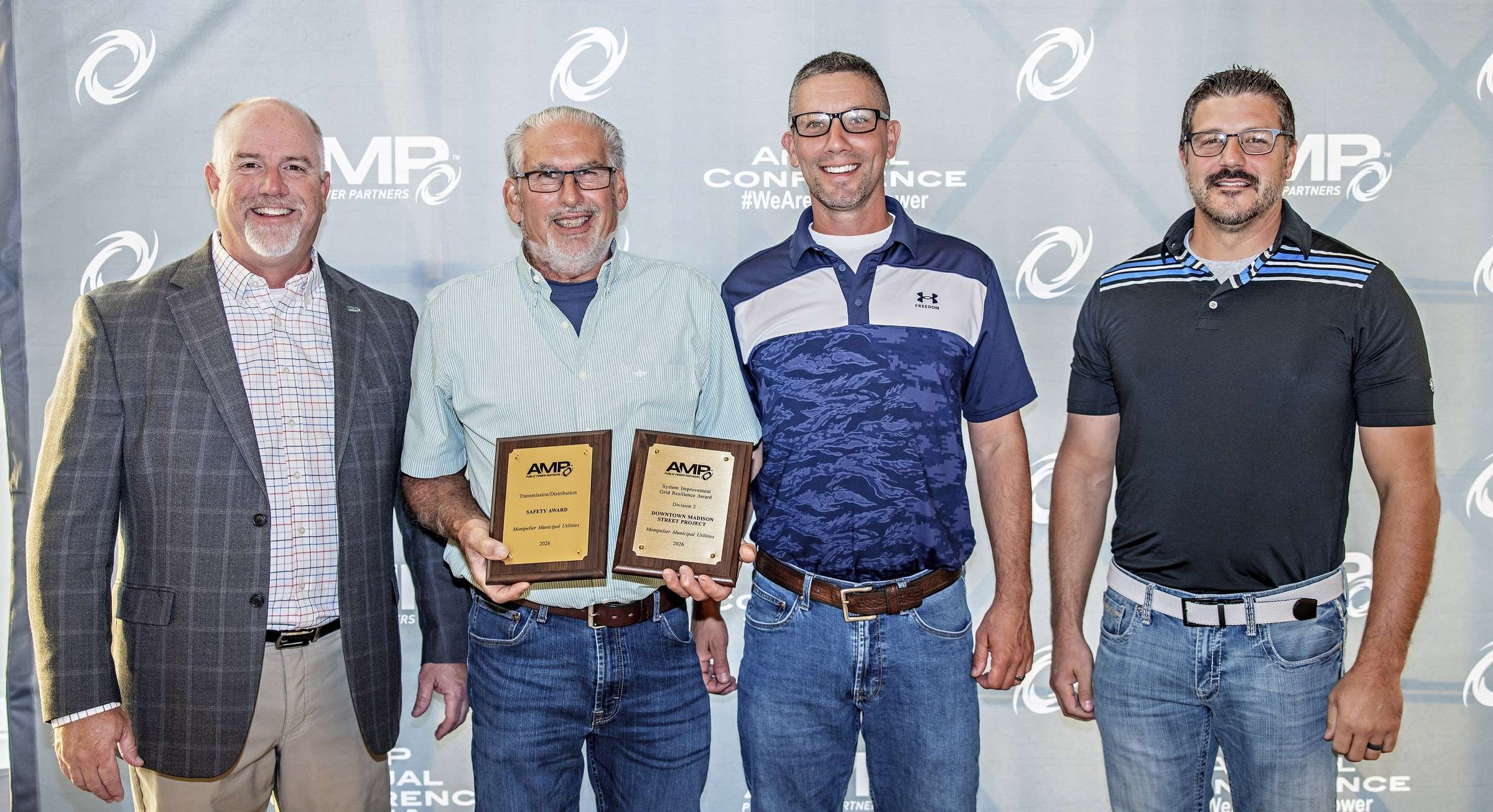 Jason Rockey, Tim Fry, Justin Houk and Drew Shepard of Montpelier Municipal Utilities with two AMP awards