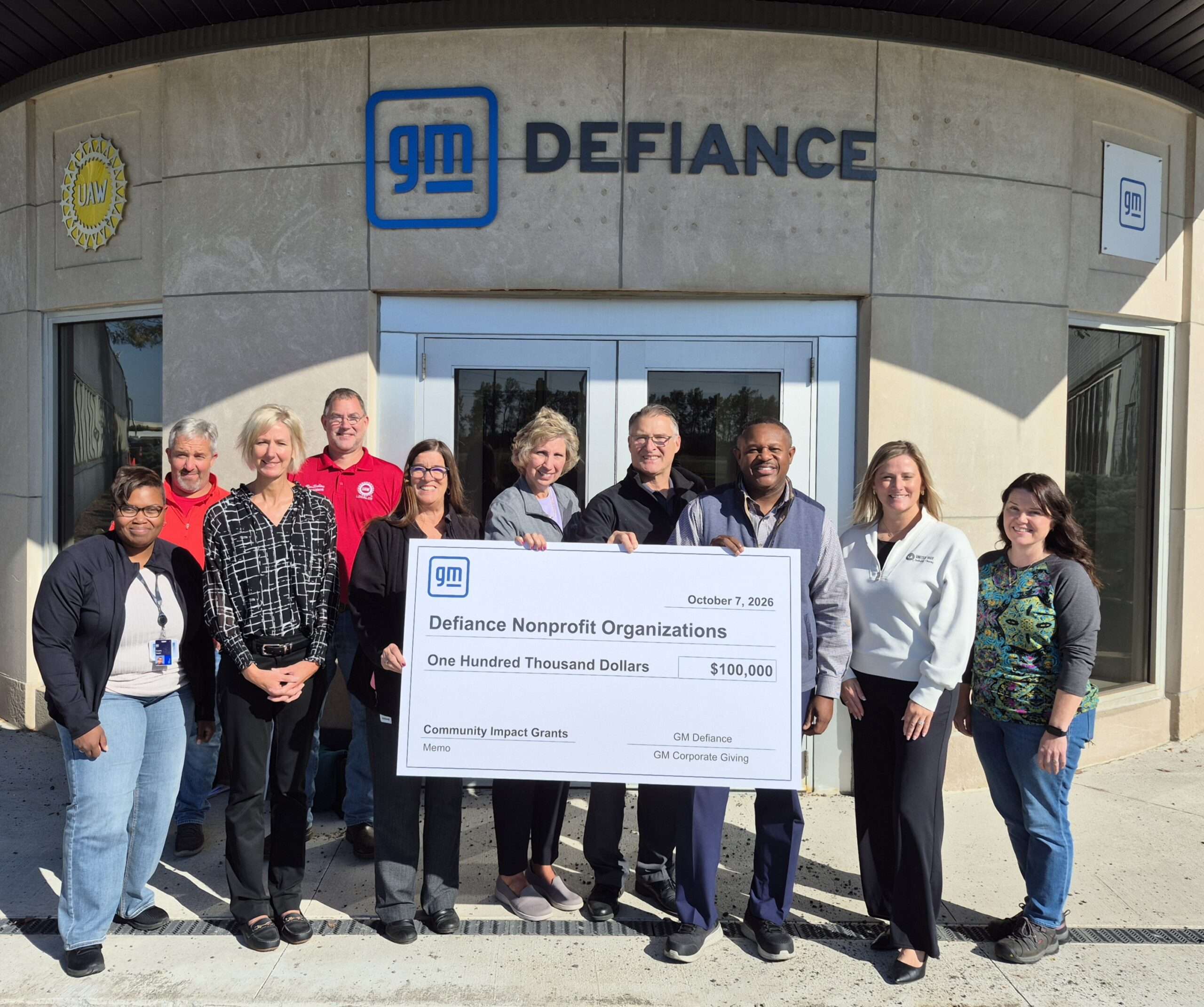 Northwest State Community College and General Motors Defiance representatives with a $100,000 Community Impact Grants check