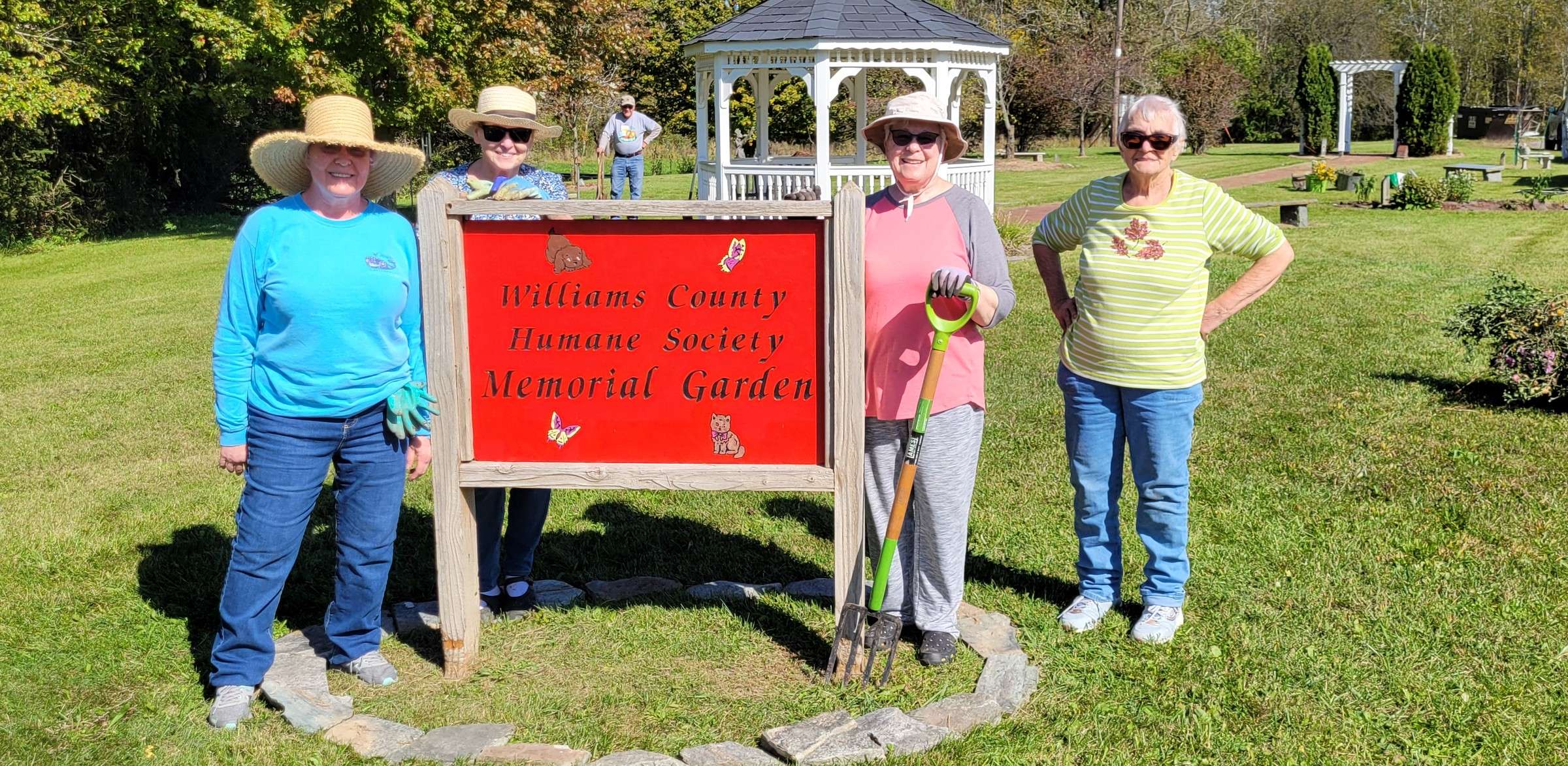 Pulaski Garden Club members at the Williams County Humane Society Memorial Garden sign