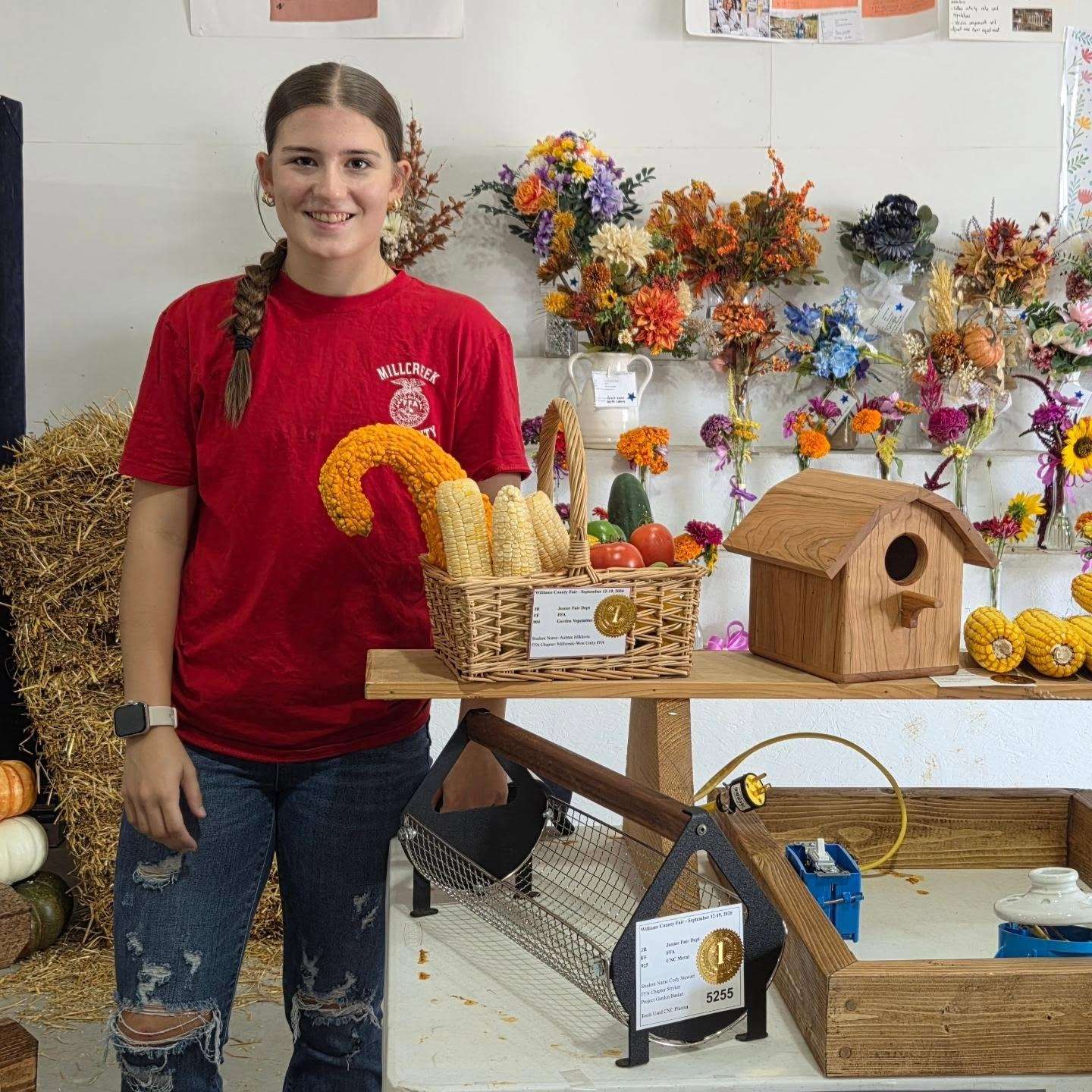 Aubree Miklovic with her best of show vegetables