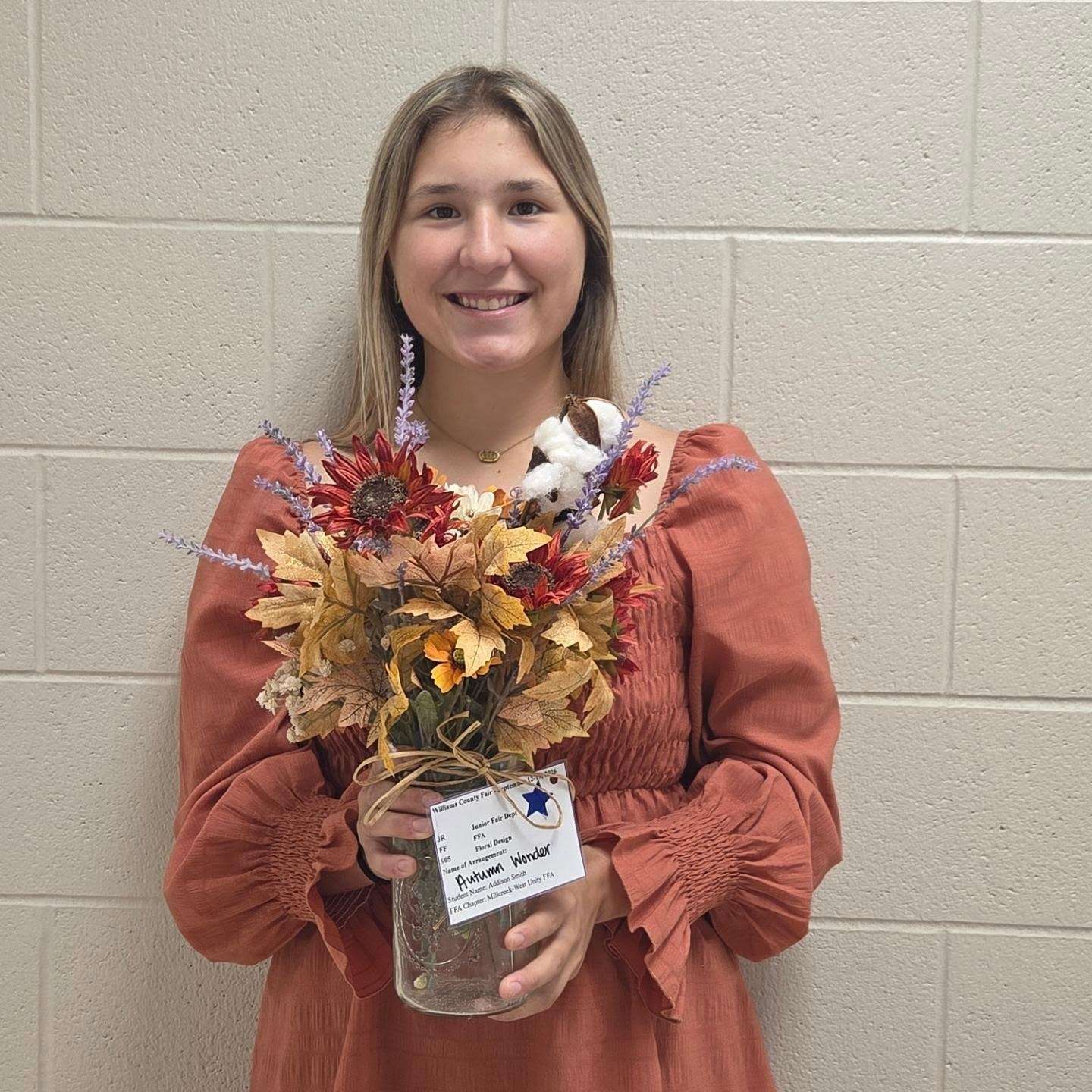 Sophia Crossgrove with her best of show floral design