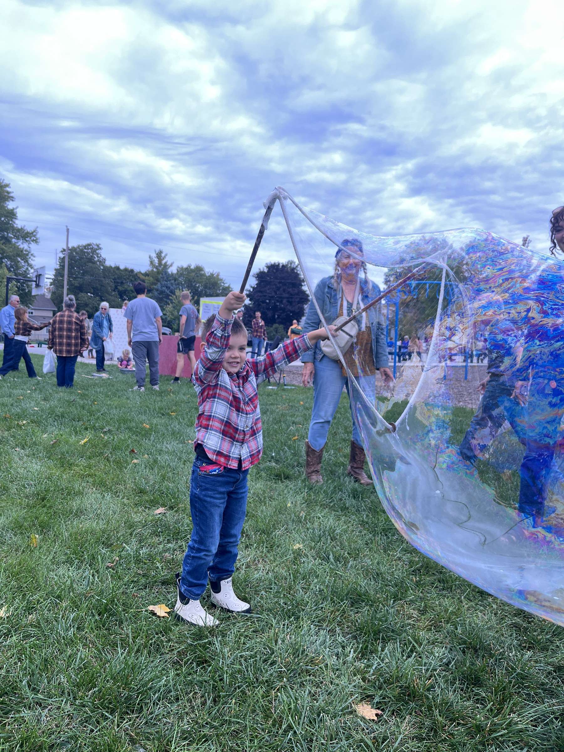 St. Mary School Grandparent Day carnival: a boy with a giant bubble wand