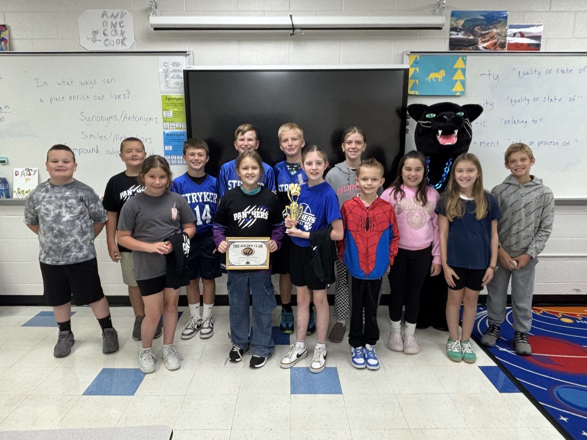 Tye Towns’ class at Stryker with the Golden Claw award and Rocky the Panther