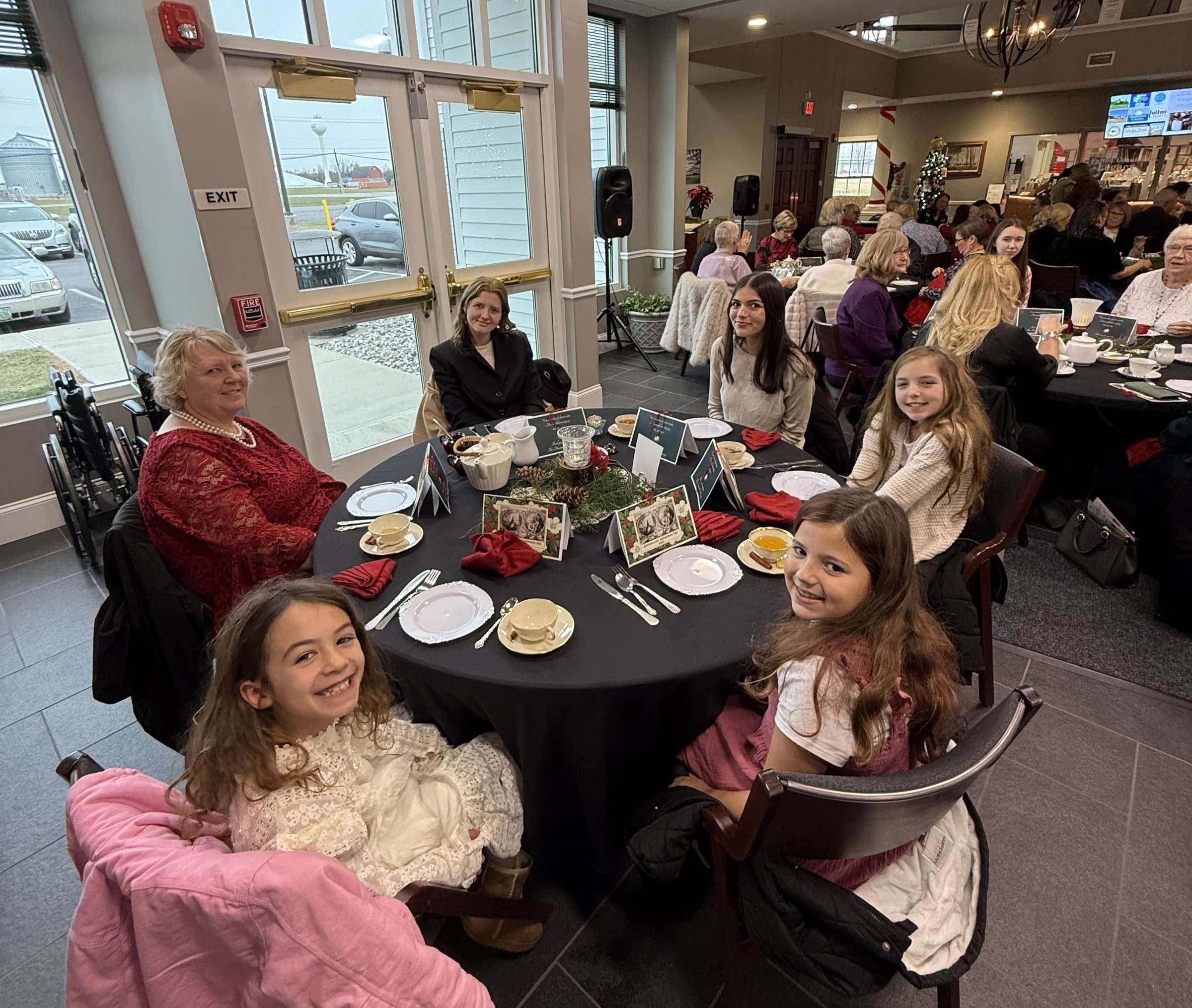 Girls at a table during an earlier Christmas Tea at the Museum of Fulton County