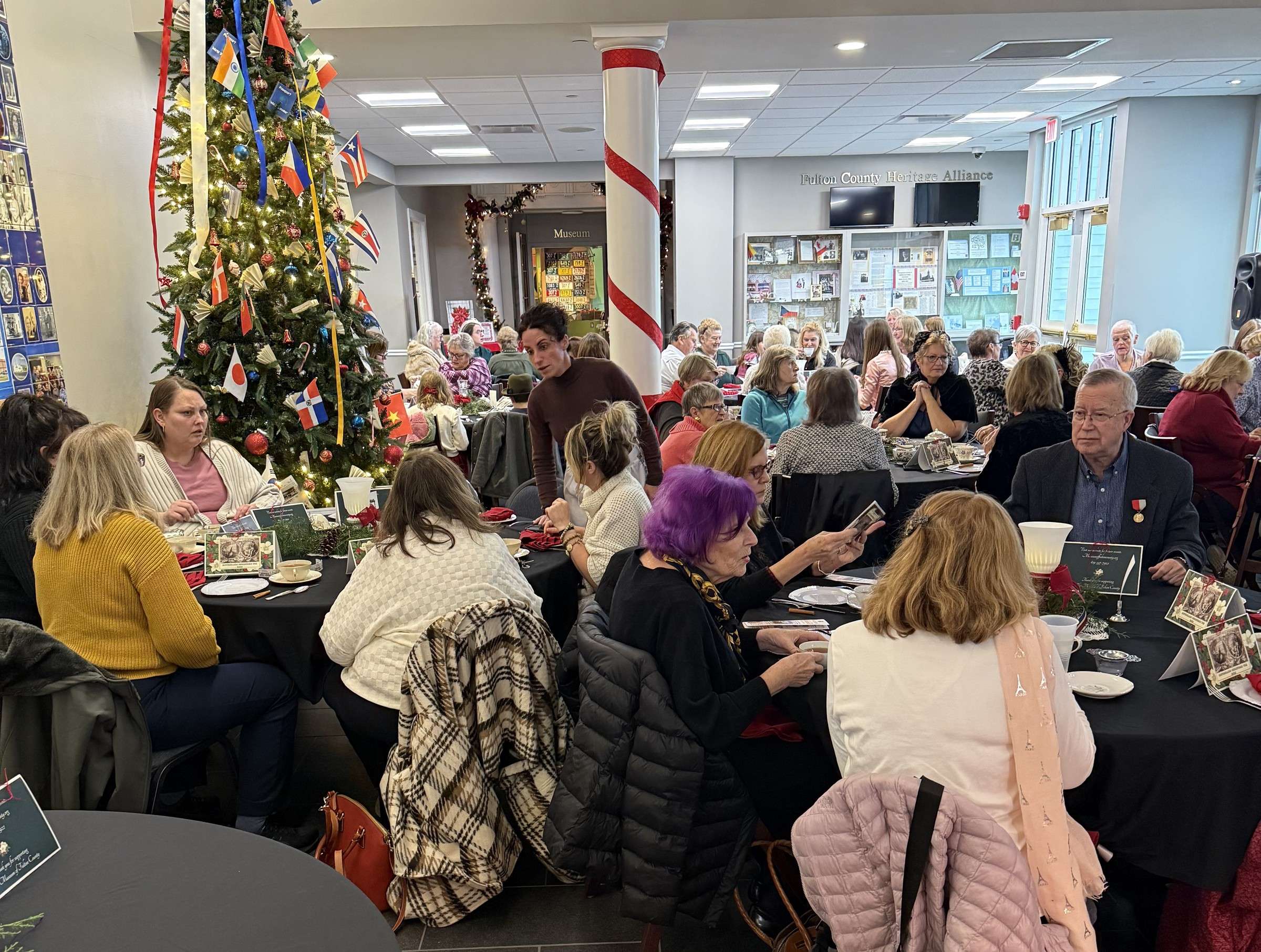 Guests at an earlier Christmas Tea at the Museum of Fulton County