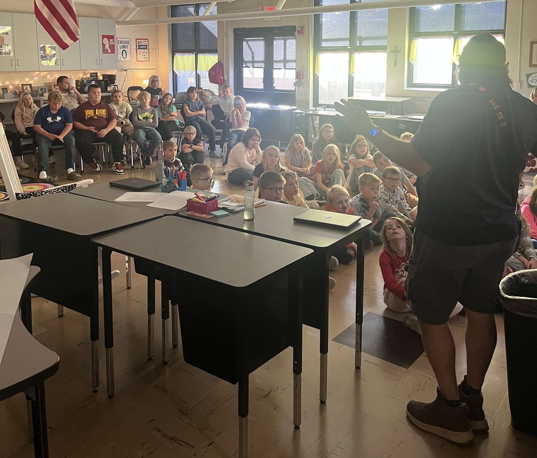 A presenter speaks to seated St. Mary School students in a classroom