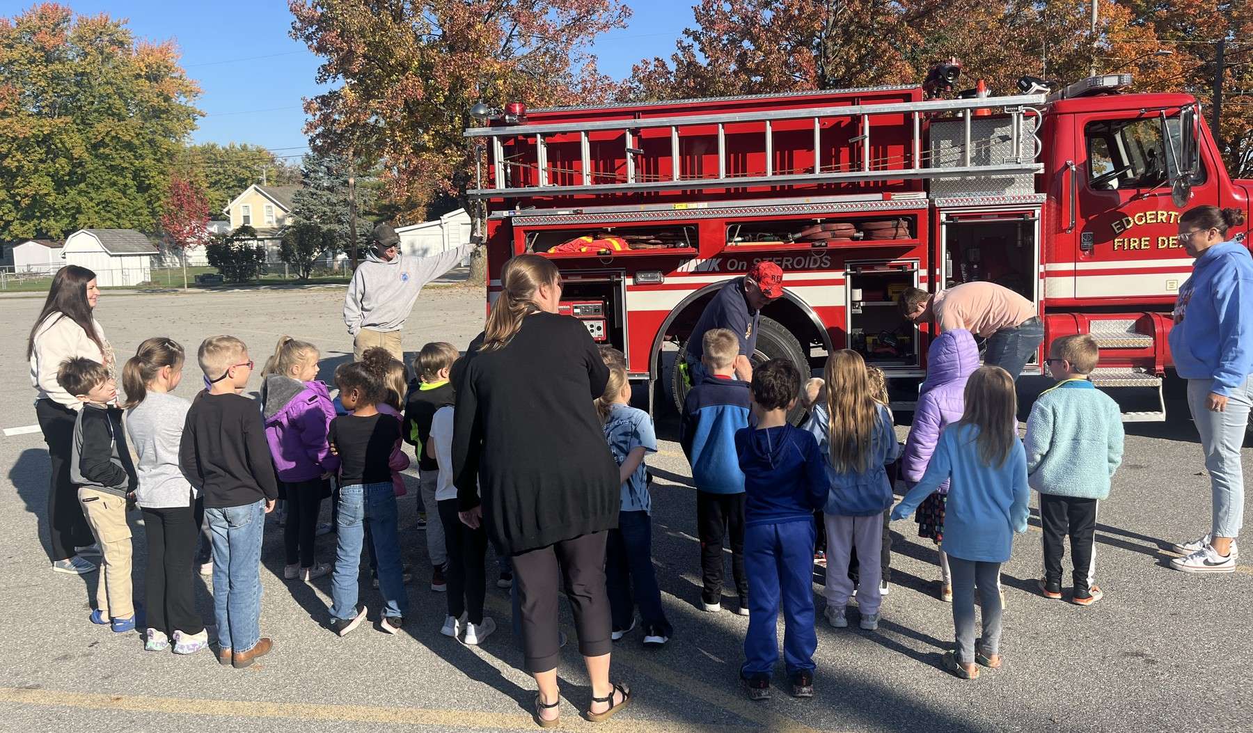 Students gather around an Edgerton Fire Department truck outside St. Mary School