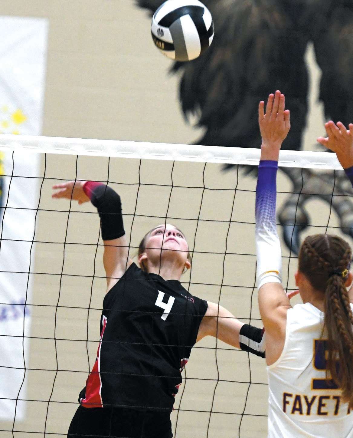 North Central senior setter Anna Burt (4) at the net during a volleyball match