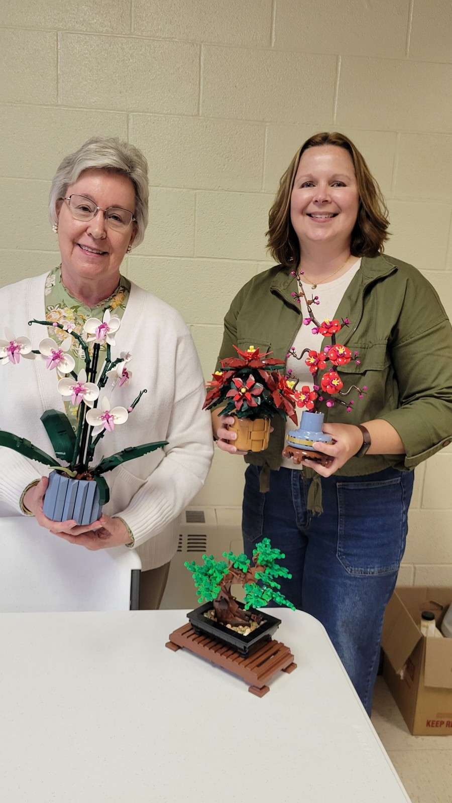 Connie McGrew and Michelle O’Dell with their Lego Botanicals