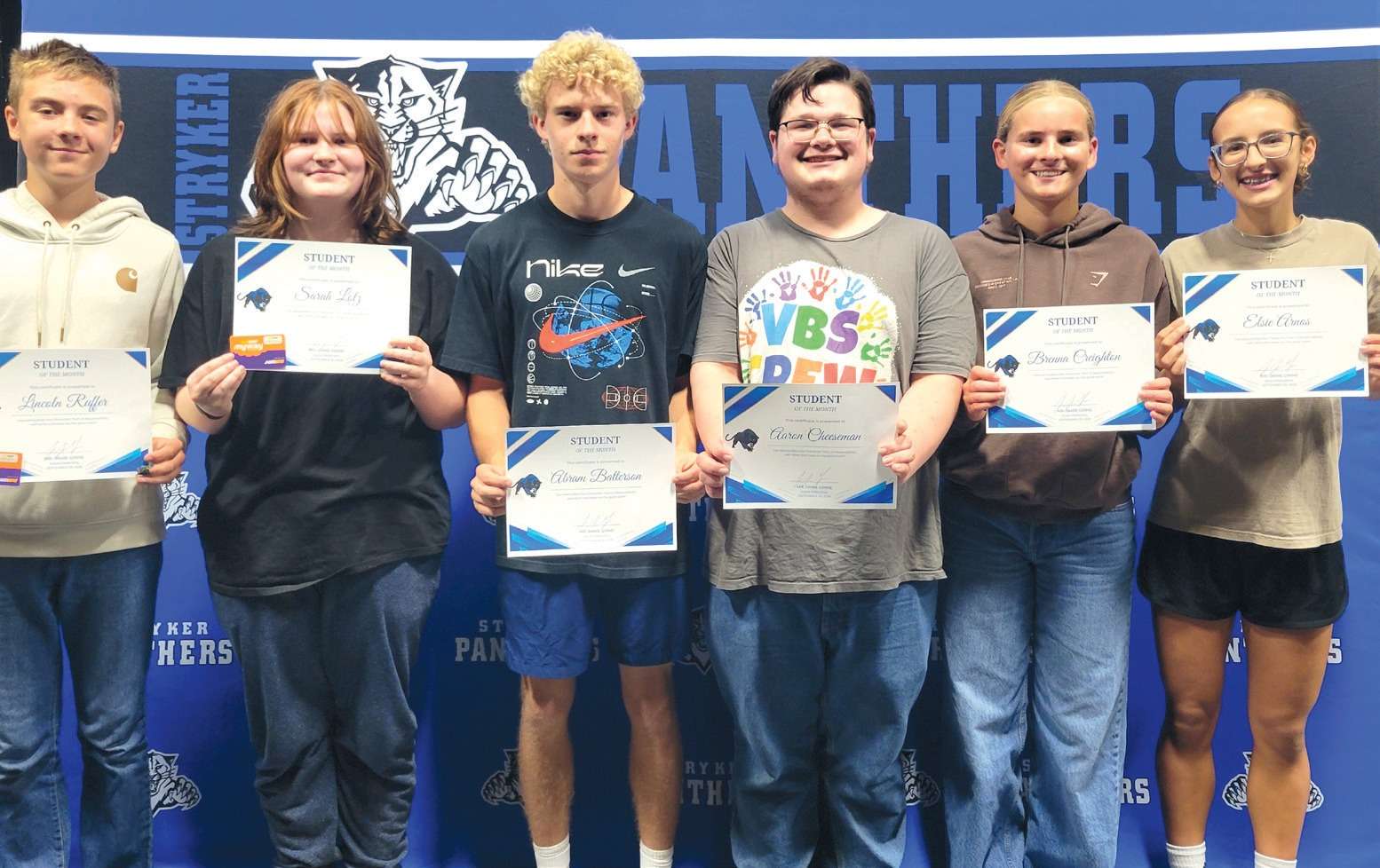 Stryker Local Schools September Students of the Month holding certificates